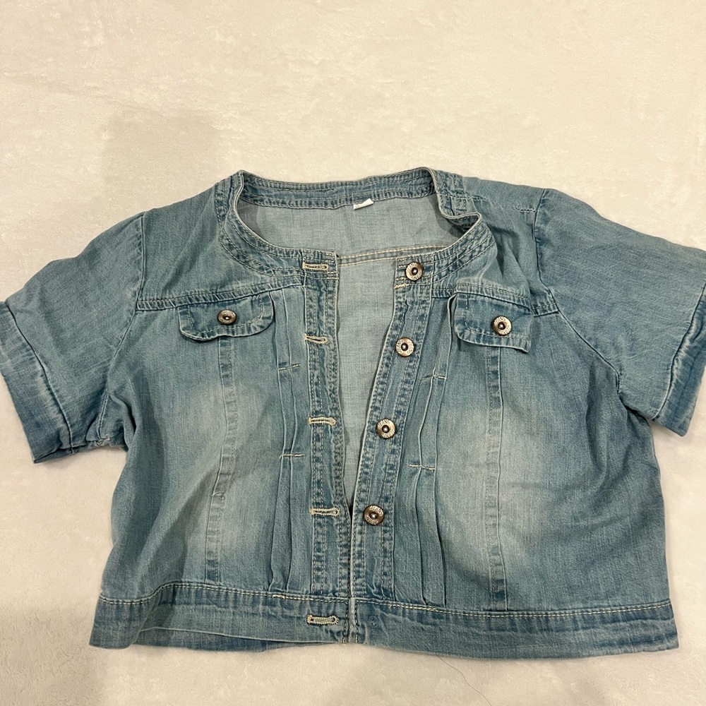 Cropped jean jacket.. lightweight denim with short sleeves. Missing one button!